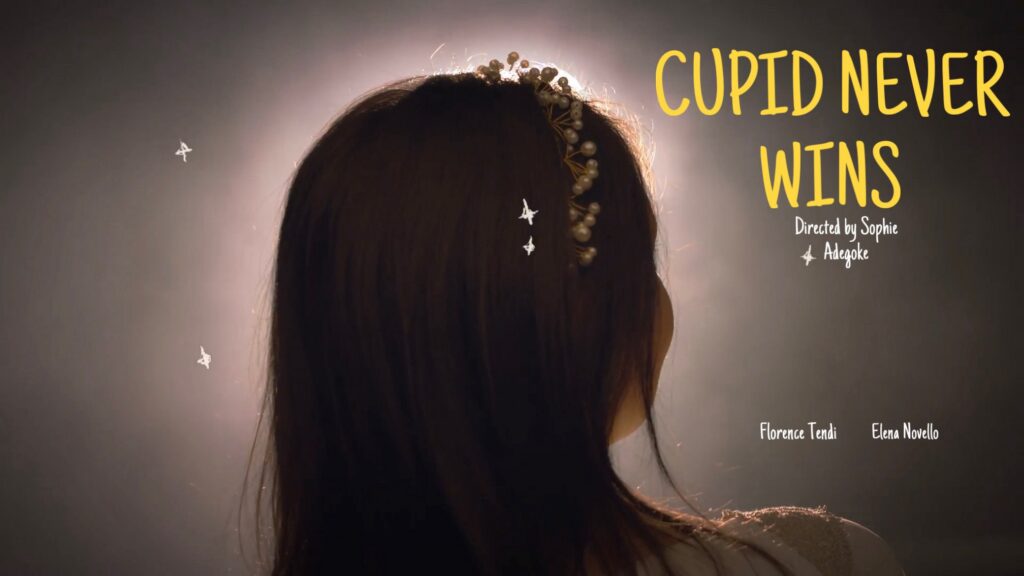 Cupid Never Wins title card: backlit woman with a pearl headpiece seen from behind